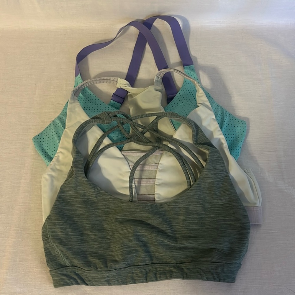 Three Victoria's Secret sports bras